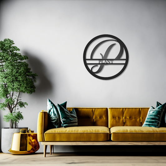 Round Personalized Family Name with Scroll Initial Metal Sign with "PLANT" personalization shown on a wall in a modern design living room