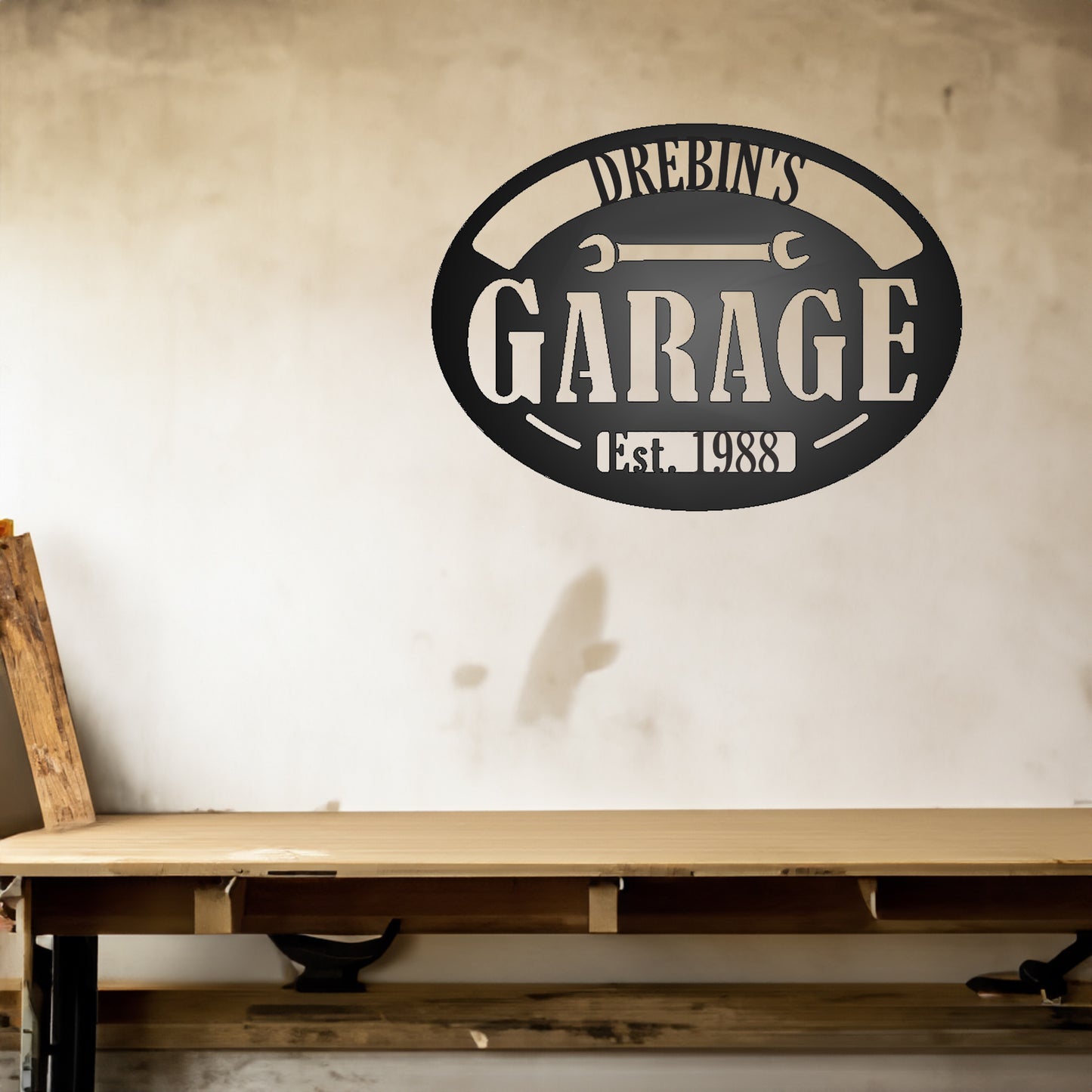 Personalized Pop's Garage Metal Sign "DREBIN'S 1988" shown on a wall in a garage