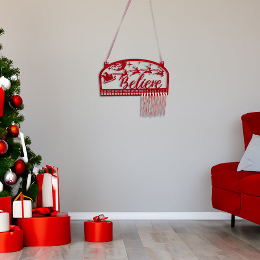 Christmas Countdown Believe Candy Cane Hanger red on wall in holiday decorated living room