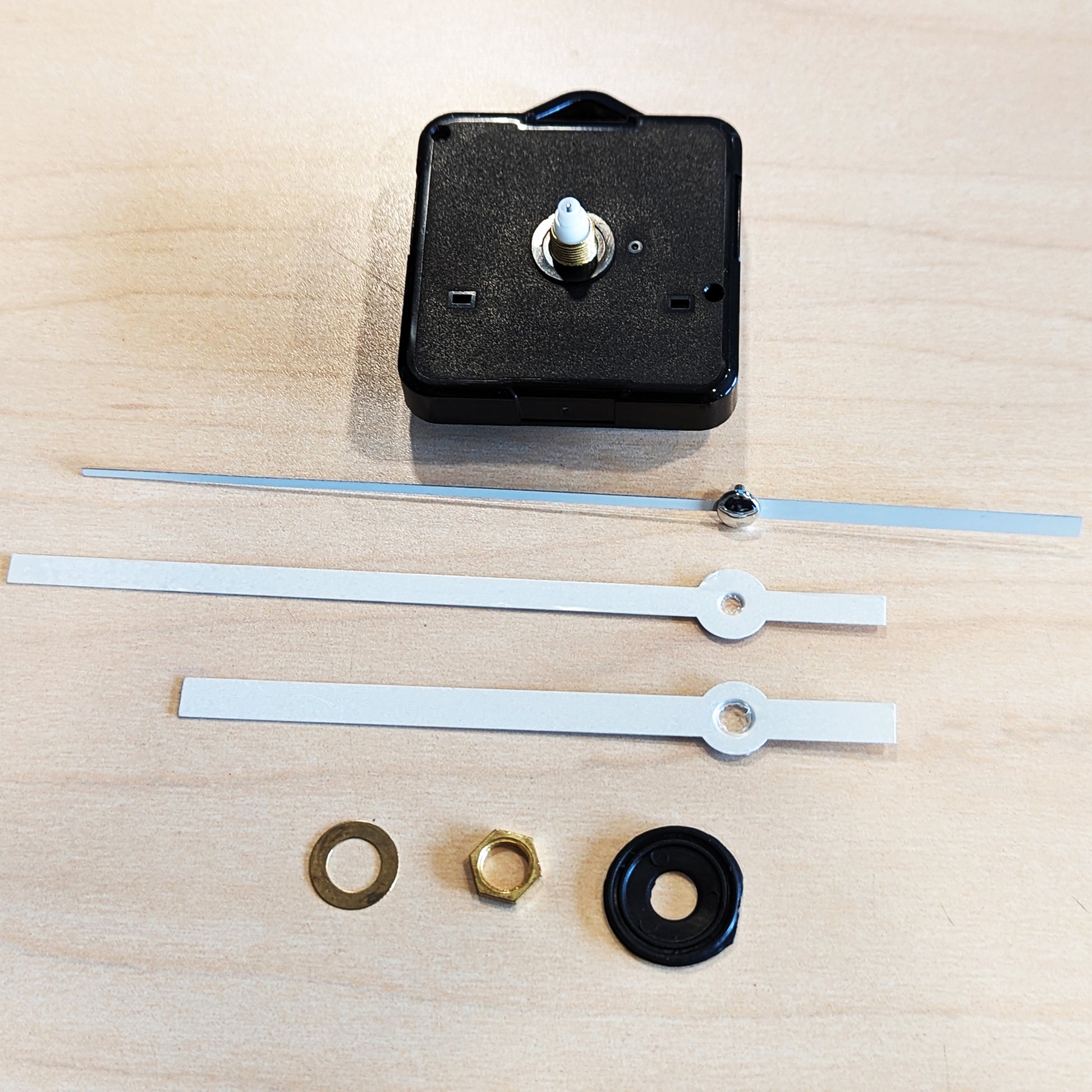 Clock Mechanism with White Hands Replacement with hands and hardware front view