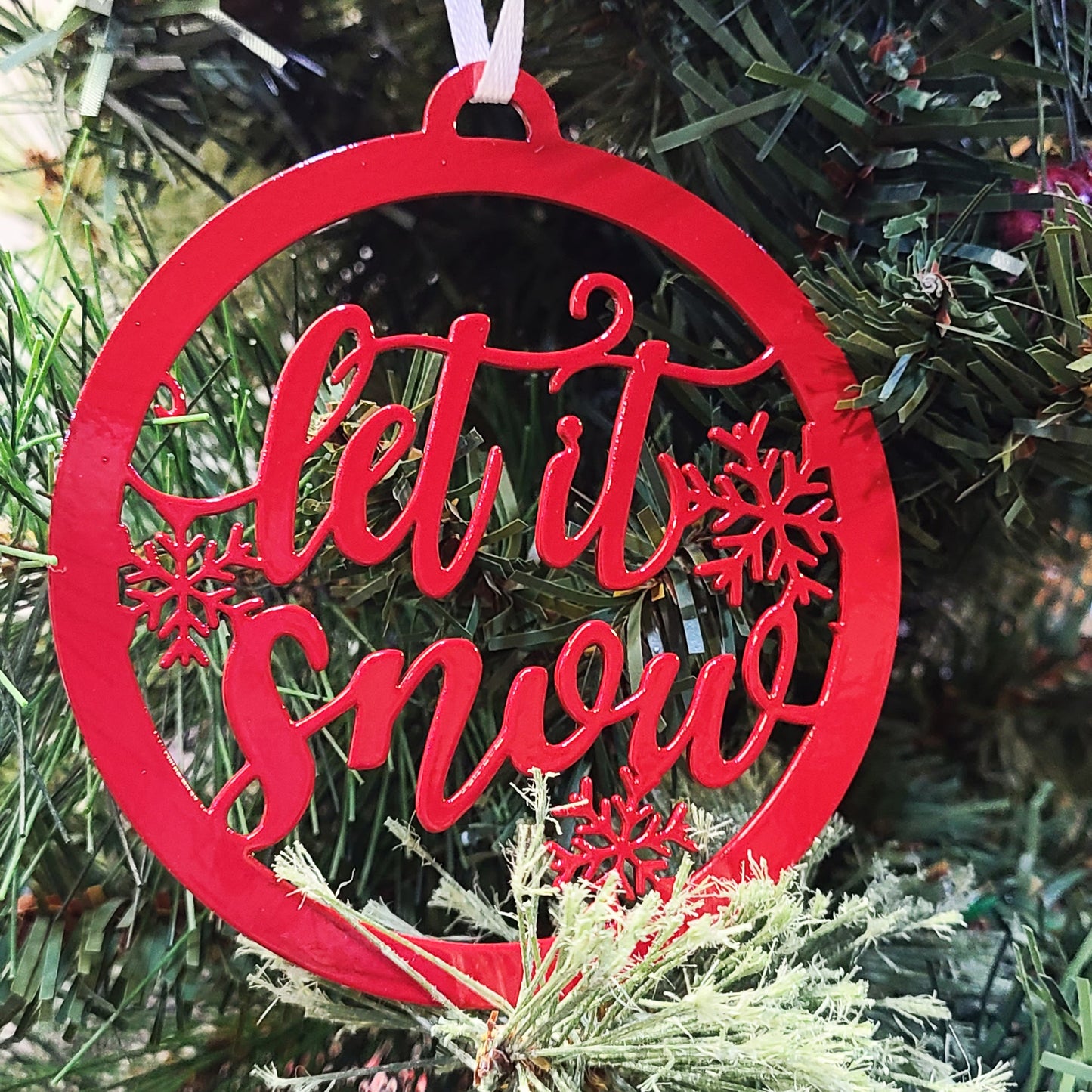 Let it Snow Holiday Ornament Red on a Christmas tree