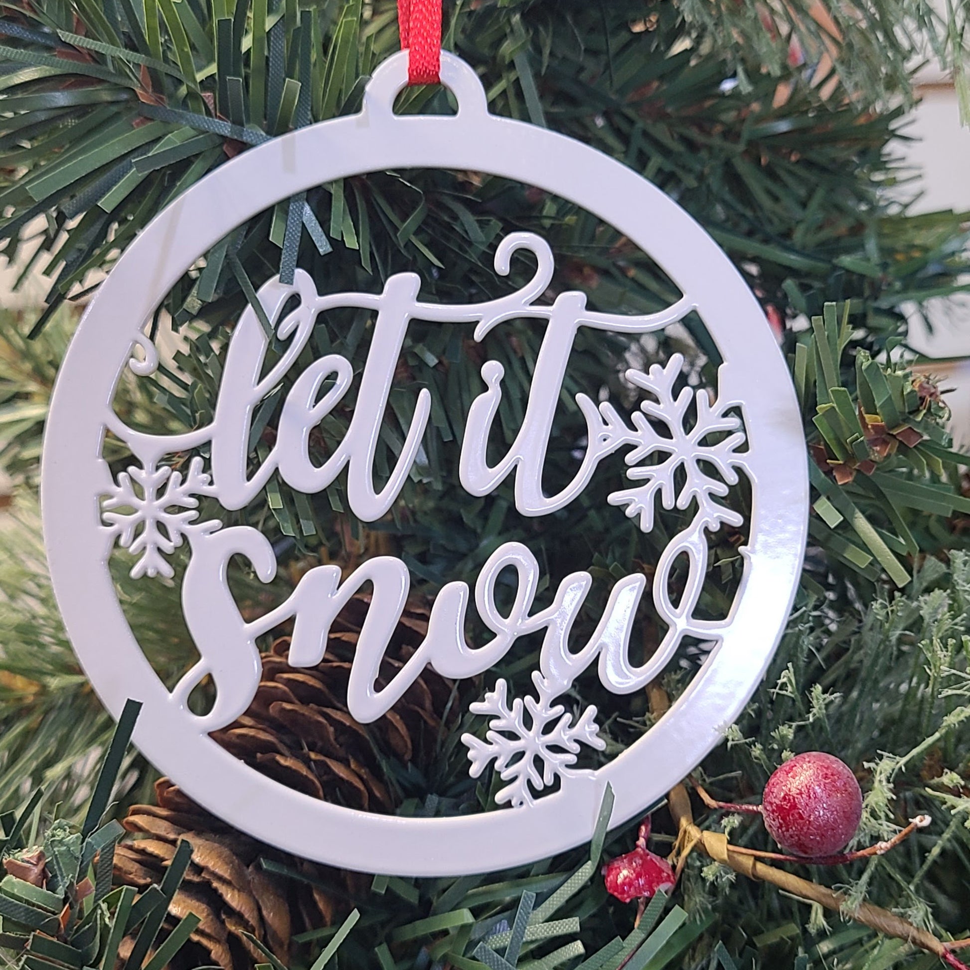 Let it Snow Holiday Ornament Silver on Christmas tree
