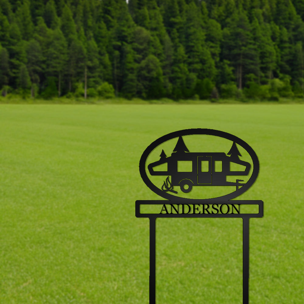 Pop-up Camper with Personalized Name Metal Sign with "ANDERSON" personalization in a grassy field