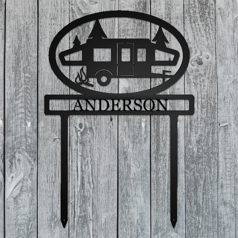 Pop-up Camper with Personalized Name Metal Sign with "ANDERSON" personalization on a gray wood background