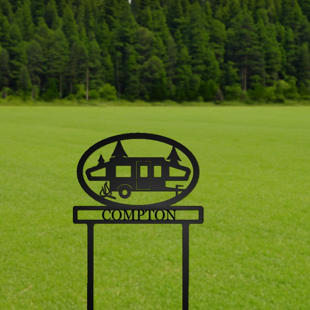 Pop-up Camper with Personalized Name Metal Sign with "COMPTON" personalization with a grassy field background