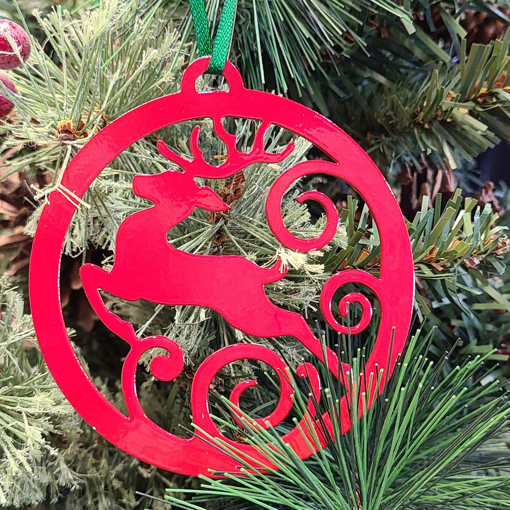 Reindeer Jumping Holiday Ornament Red on Christmas tree
