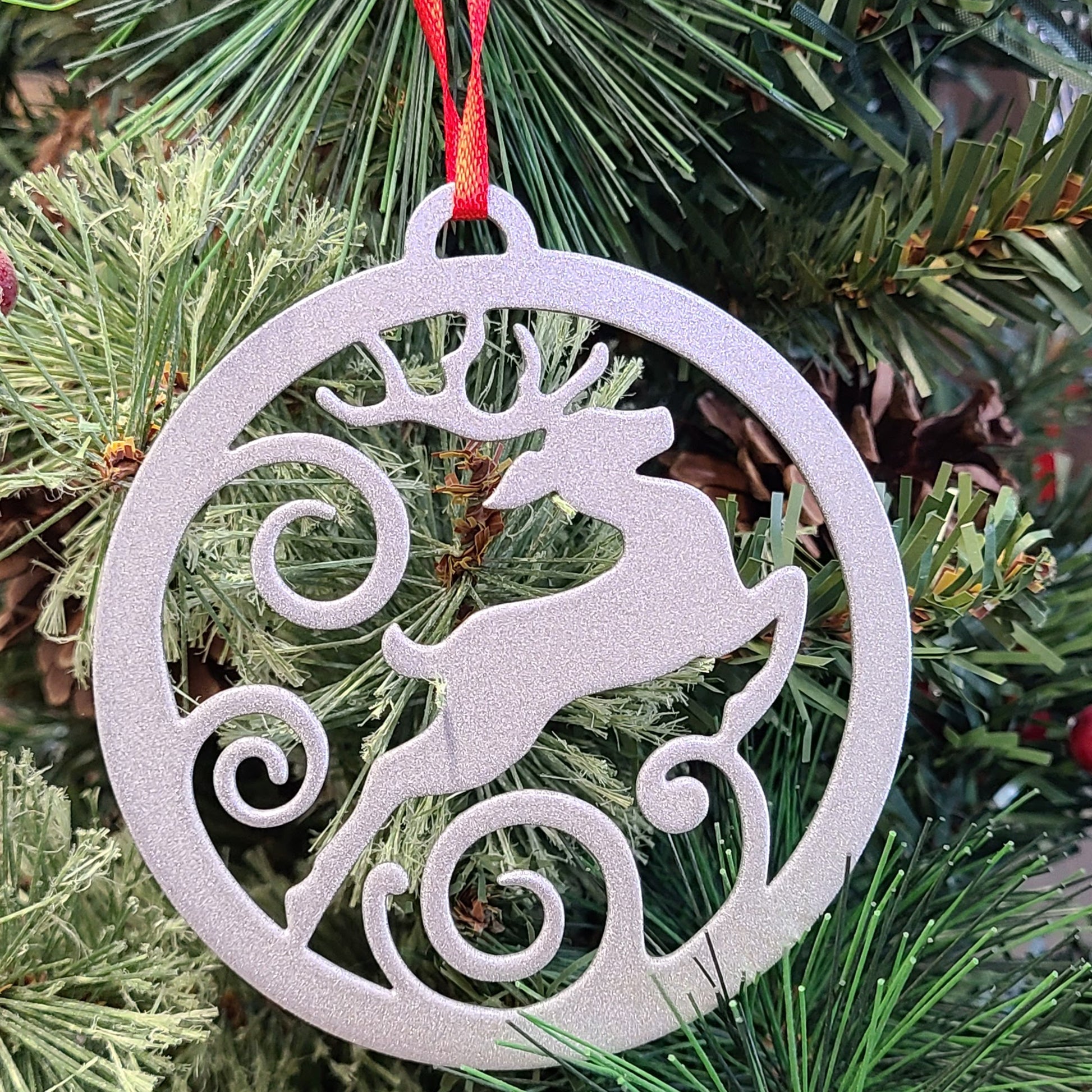 Reindeer Jumping Holiday Ornament Silver on Christmas tree