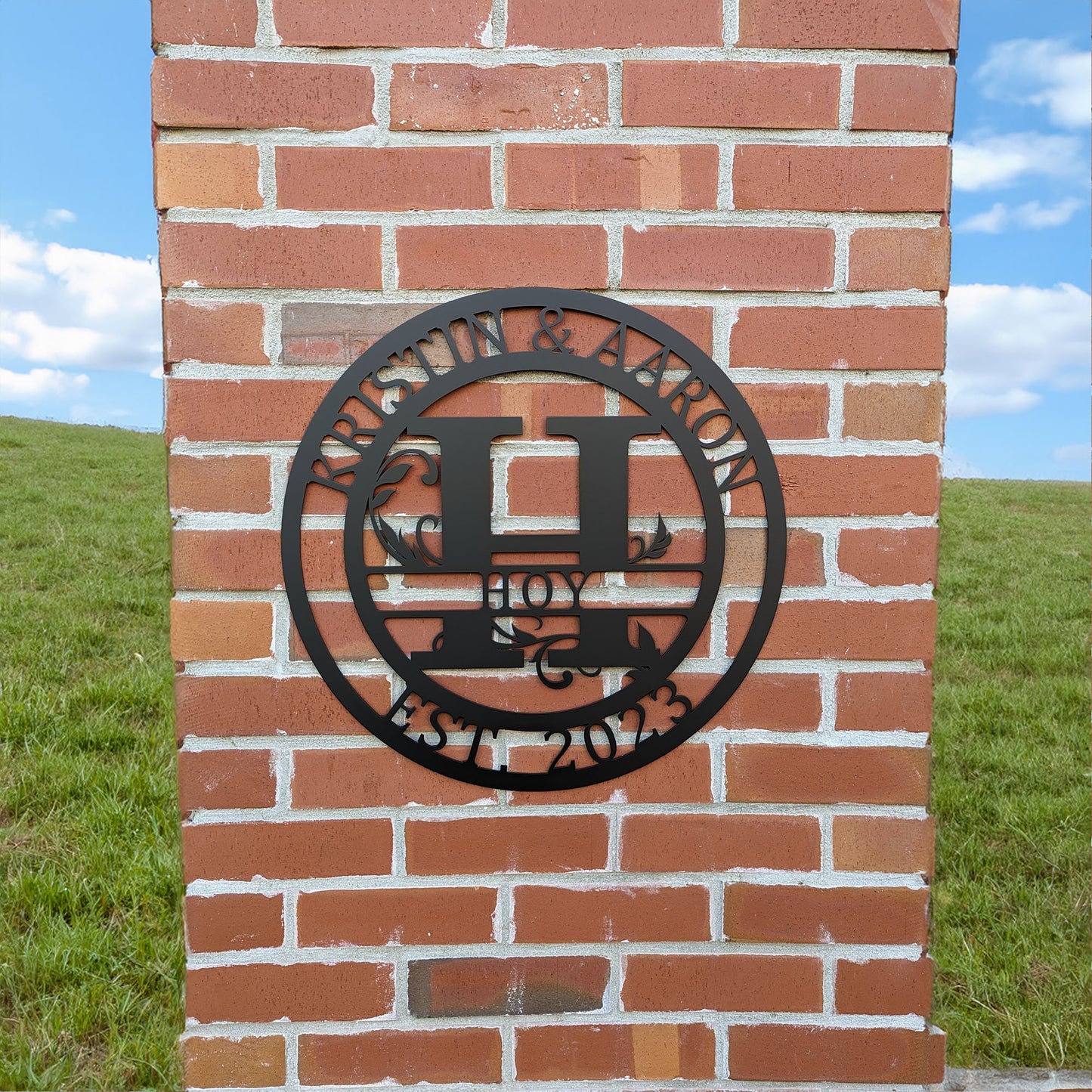 Round Scroll Monogram with Top Personalization and EST Date with "KRISTIN & AARON HOY EST 2023" personalization on brick pillar