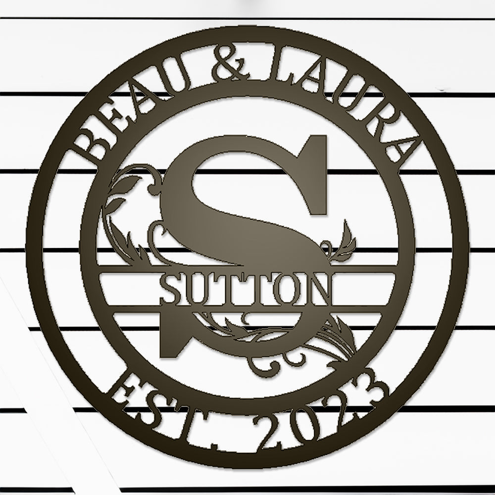 Round Scroll Monogram with Top Personalization and EST Date Bronze S with "BEAU & LAURA SUTTON 2023" personalization on white batten background