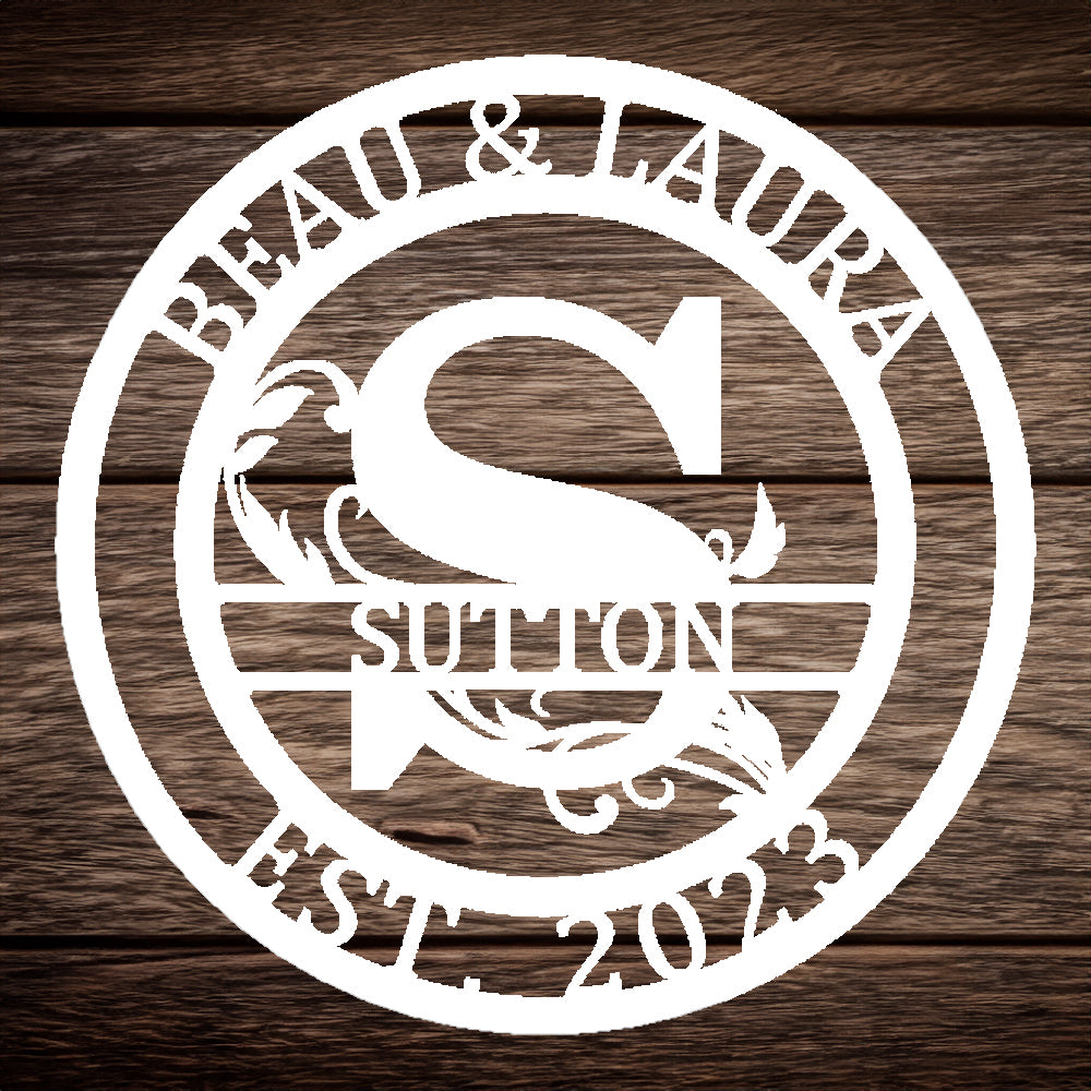 Round Scroll Monogram with Top Personalization and EST Date White S with "BEAU & LAURA SUTTON 2023" personalization on wood background