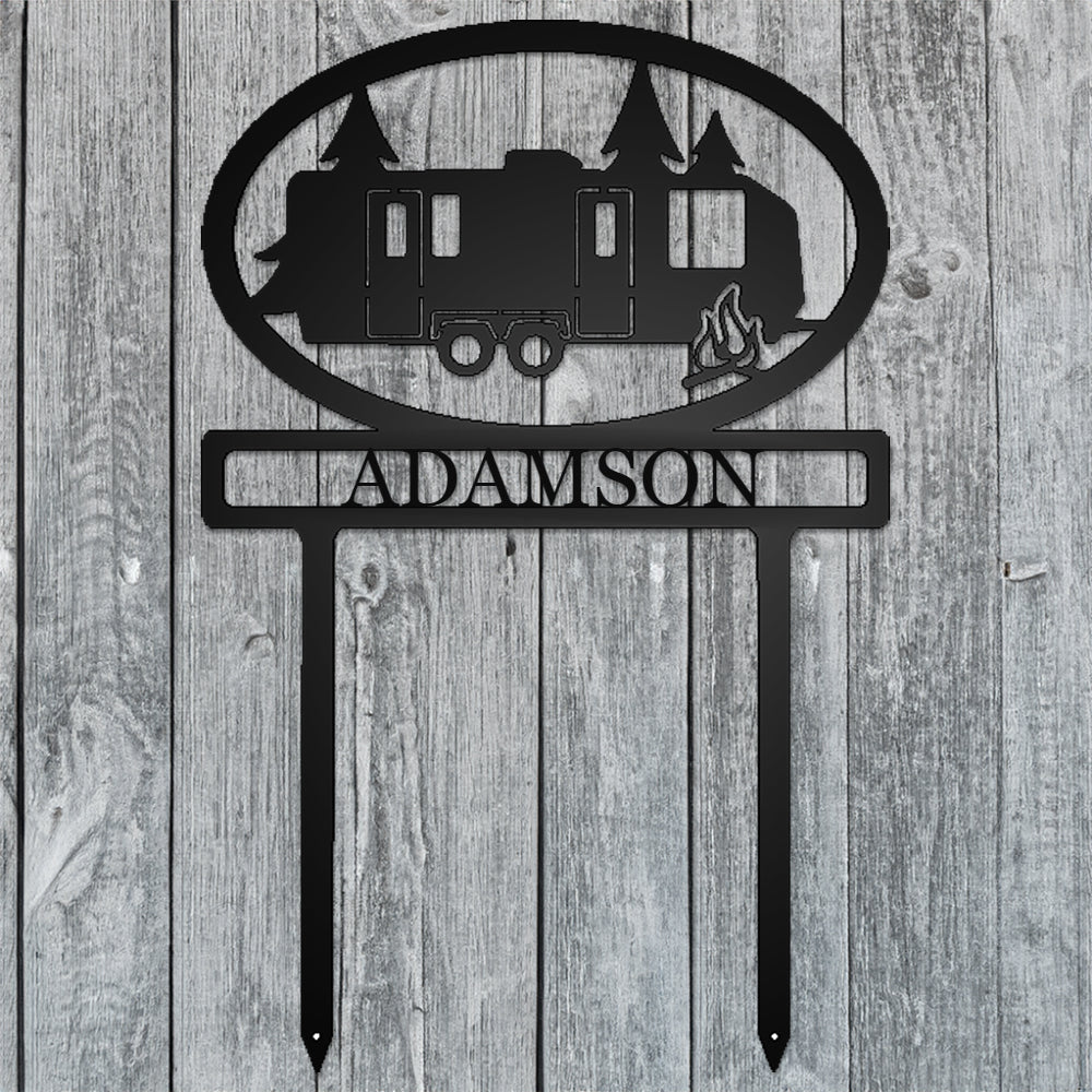 Travel Trailer with Personalized Name Metal Sign with "ADAMSON" personalization on gray wood background