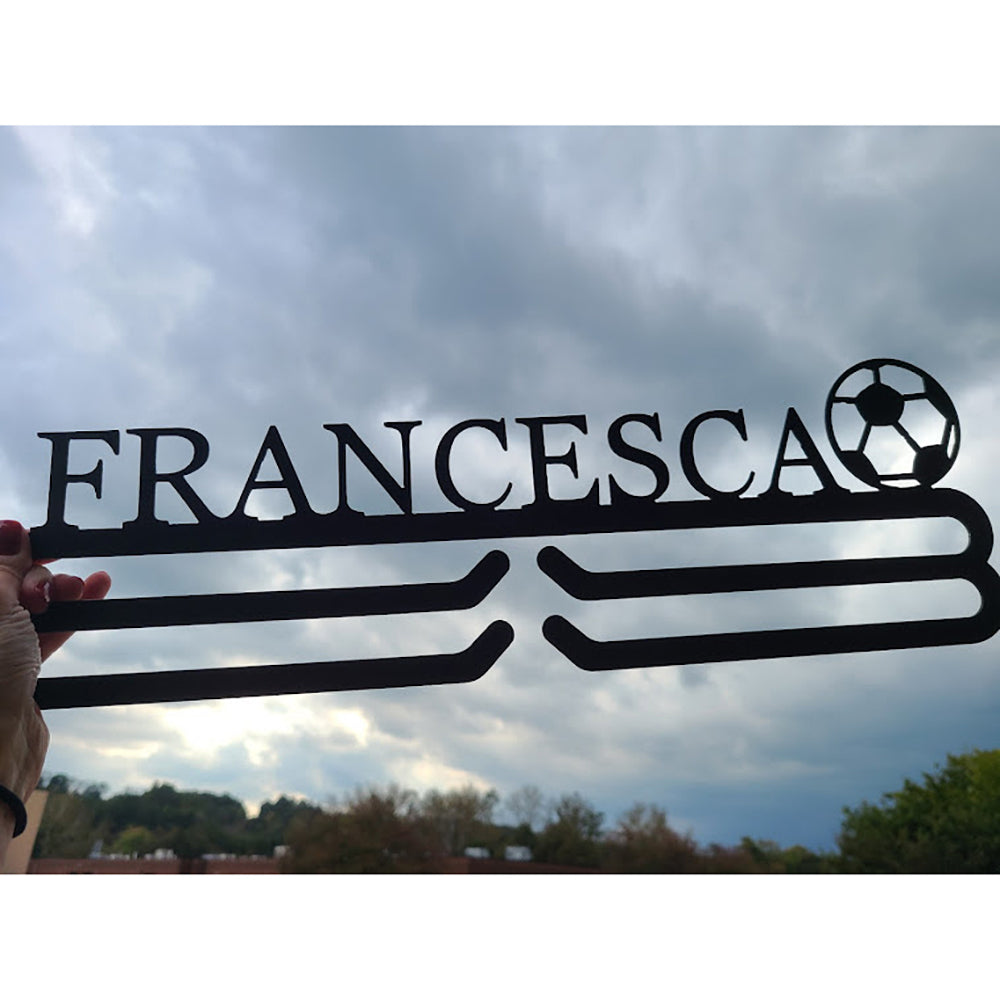 Personalized Soccer Medal Hanger with "FRANCESCA" personalization with cloudy sky background