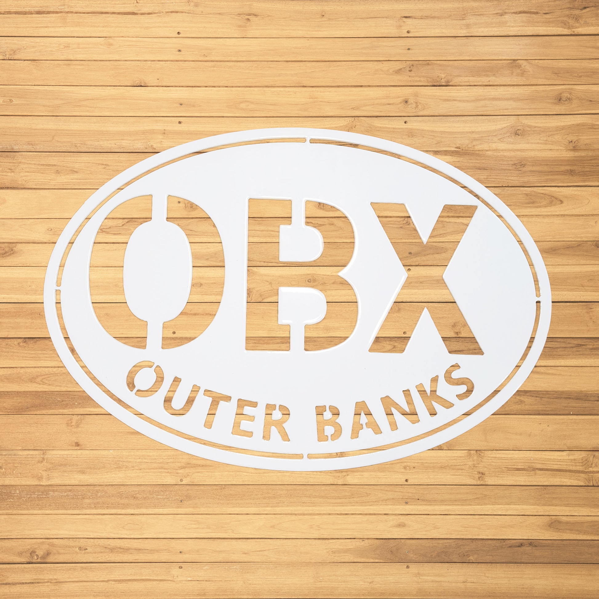 Outer Banks Oval Metal Wall Sign OBX White - on wood slat wall