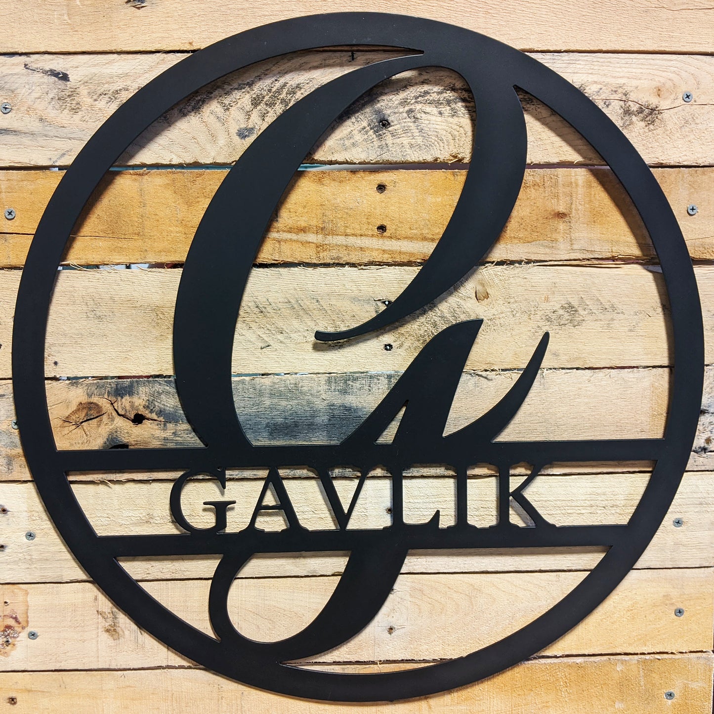 Round Personalized Family Name with Scroll Initial Metal Sign GAVLIK - on wood