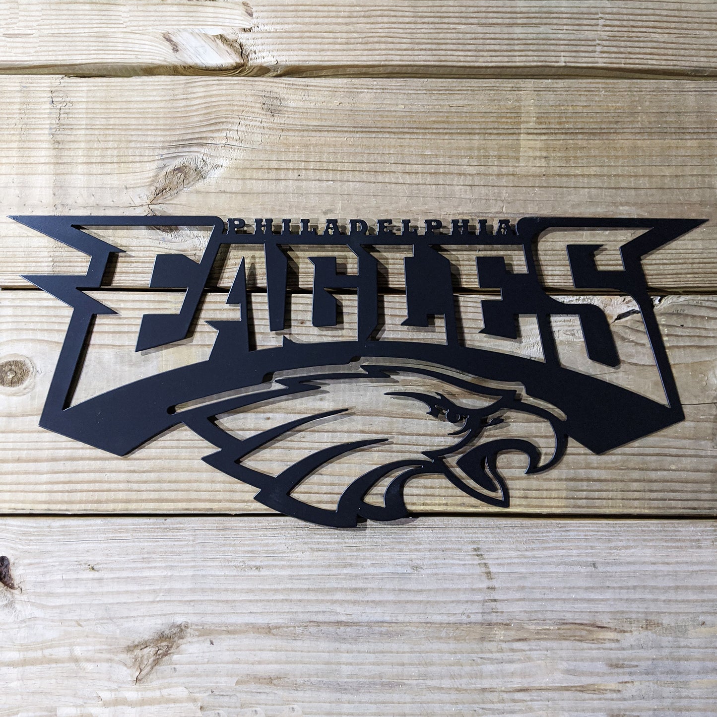 Eagles Logo Metal Sign Black - on wood
