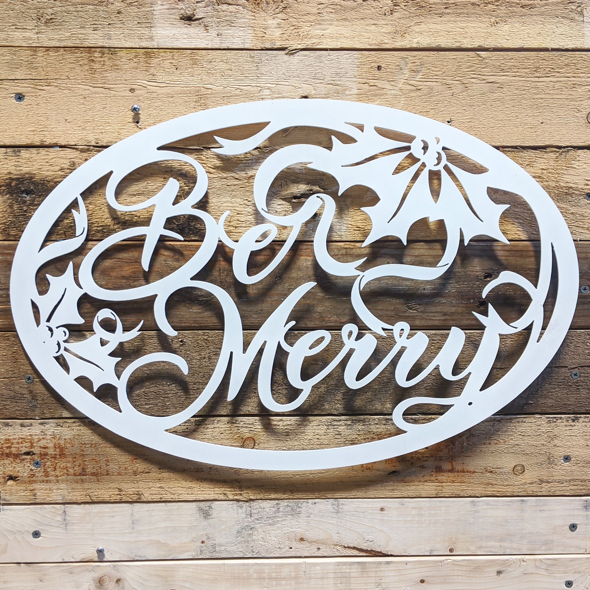 Be Merry Oval Holiday Metal Sign White - on wood slat