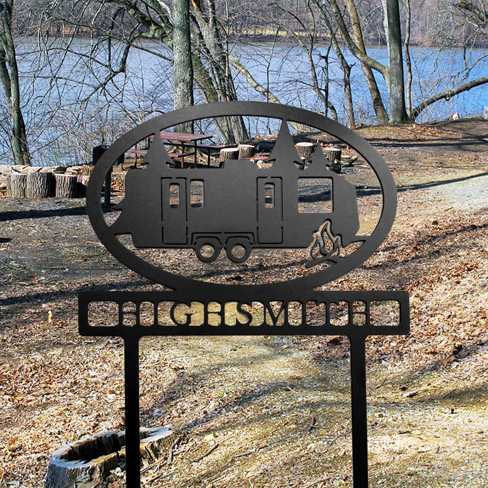 Travel Trailer with Personalized Name Metal Sign Black with "HIGHSMITH" personalization shown at lakeside campsite