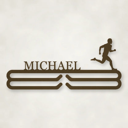 Personalized Male Runner Silhouette Medal Hanger shown in Metallic Bronze powder coat finish.