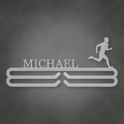 Personalized Male Runner Silhouette Medal Hanger shown in Metallic Silver powder coat finish.