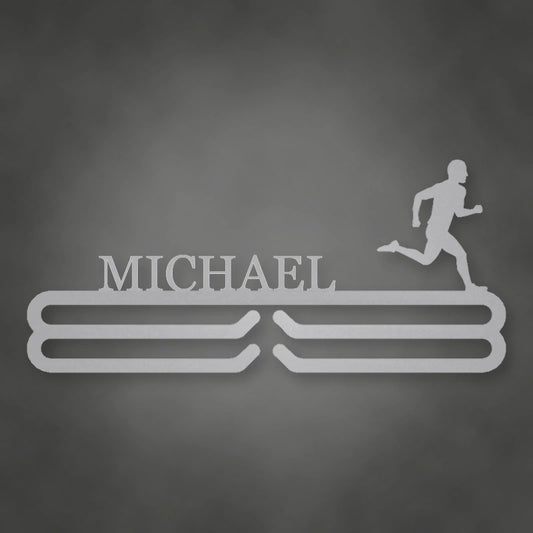 Personalized Male Runner Silhouette Medal Hanger shown in Metallic Silver powder coat finish.