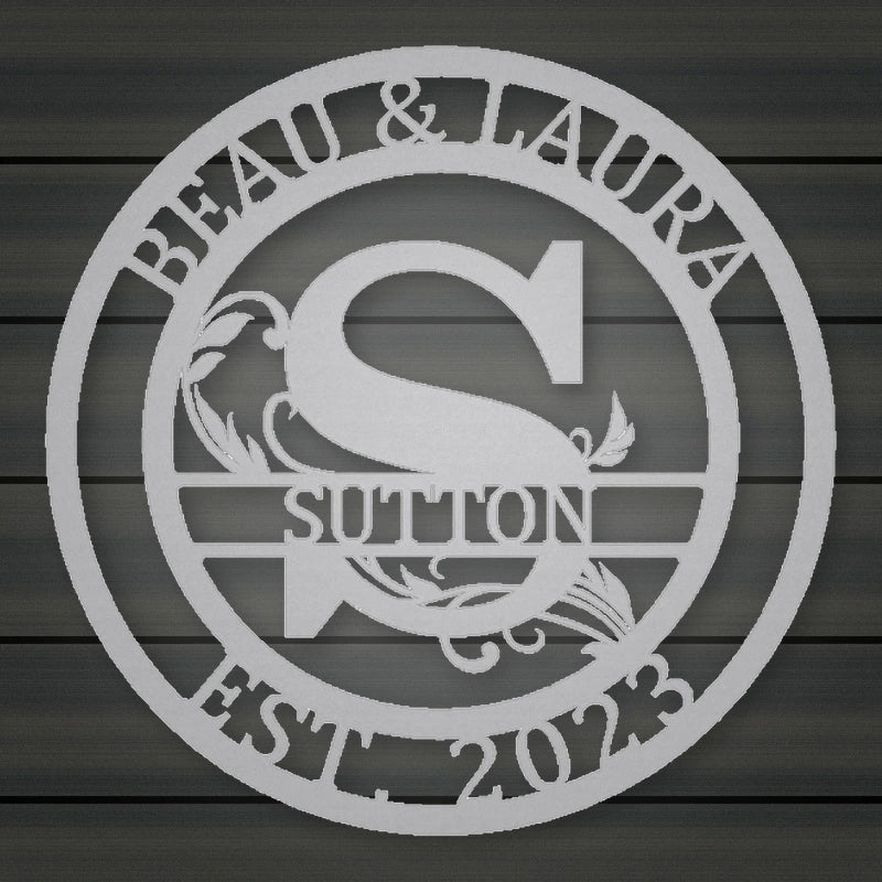 Round Scroll Monogram Metal Sign With Top Personalization And Est Date shown in Metallic Silver powder coat finish.