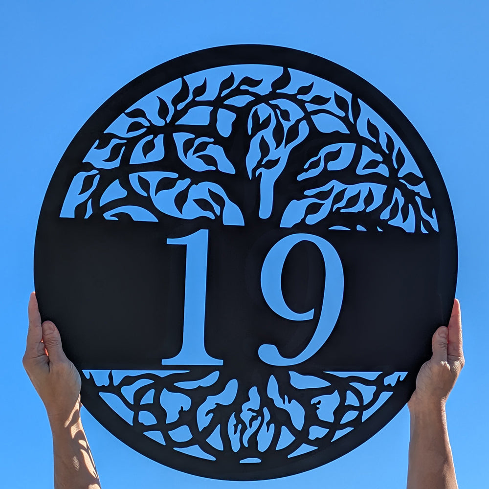 Tree of Life Metal Address Sign black with 19 personalization on blue sky background