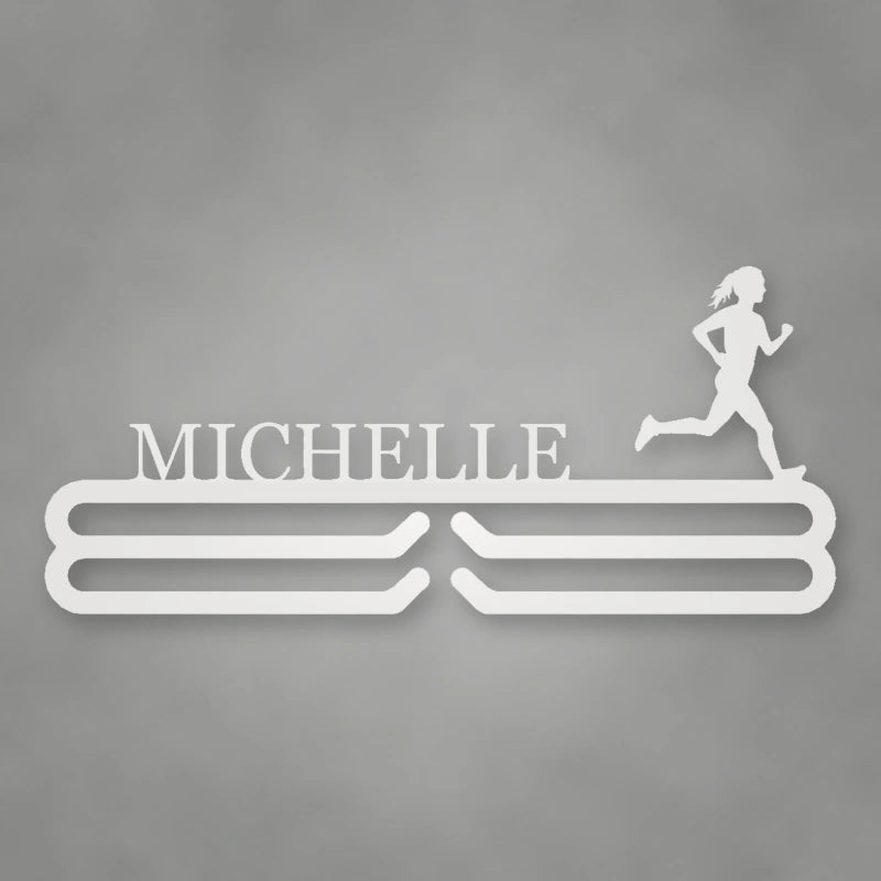 Personalized Female Runner Silhouette Medal Hanger shown in Gloss White powder coat finish.