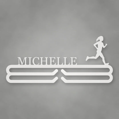 Personalized Female Runner Silhouette Medal Hanger shown in Gloss White powder coat finish.