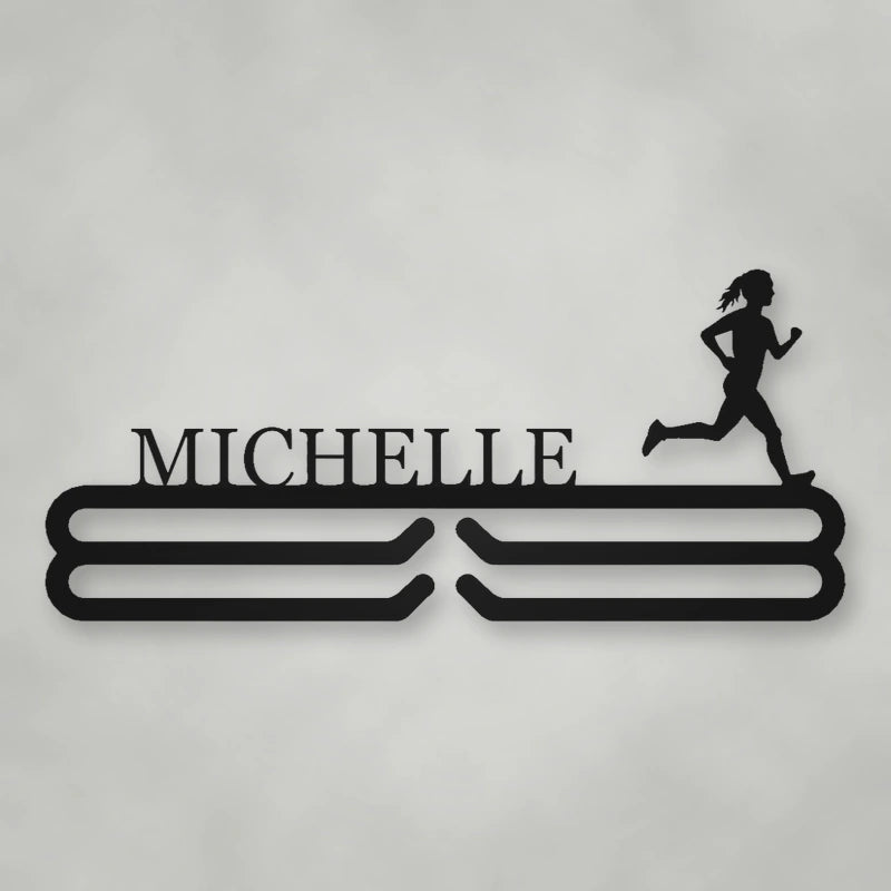 Personalized Female Runner Silhouette Medal Hanger shown in Matte Black powder coat finish.