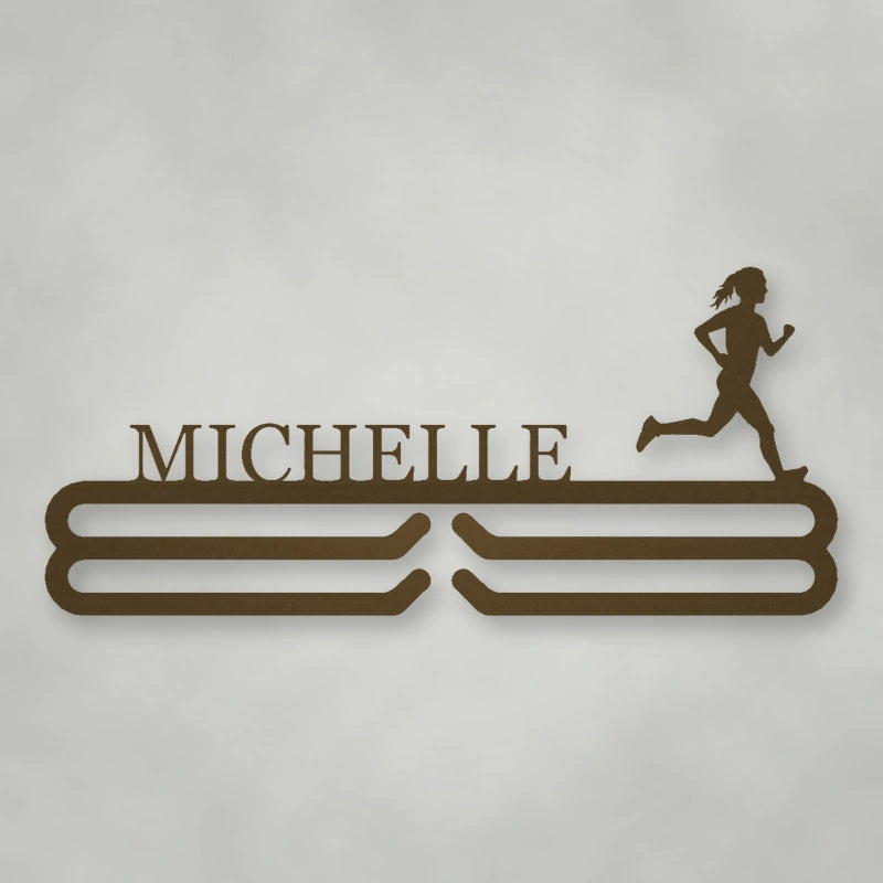 Personalized Female Runner Silhouette Medal Hanger shown in Metallic Bronze powder coat finish.