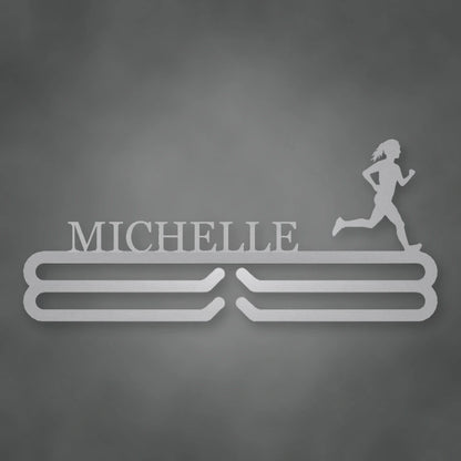 Personalized Female Runner Silhouette Medal Hanger shown in Metallic Silver powder coat finish.