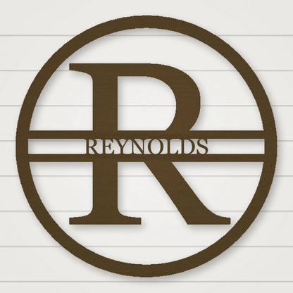 Modern Round Personalized Family Name & Initial Metal Sign shown in Metallic Bronze powder coat finish.