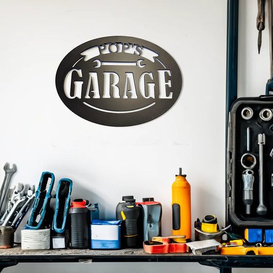 Pop's Garage Metal Sign Black on wall in workshop