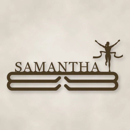 Personalized Female Runner Finish Line Medal Hanger shown in Metallic Bronze powder coat finish.