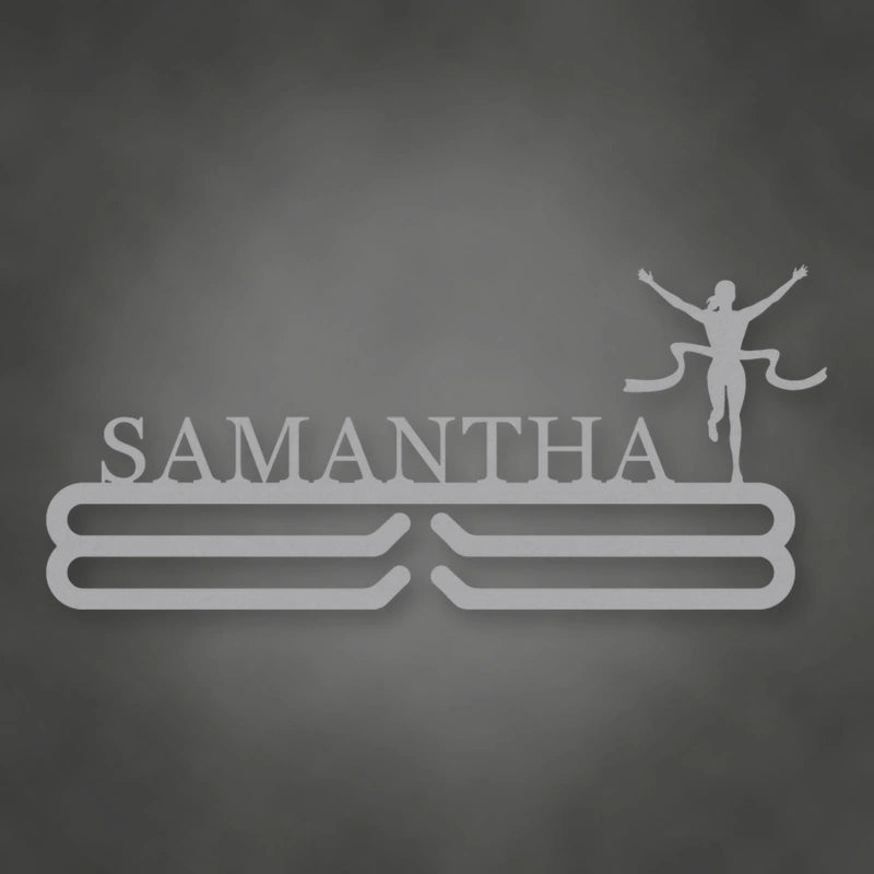 Personalized Female Runner Finish Line Medal Hanger shown in Metallic Silver powder coat finish.