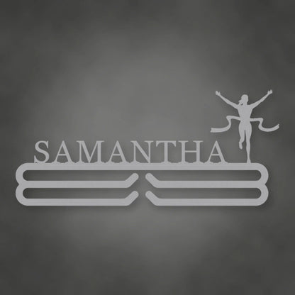 Personalized Female Runner Finish Line Medal Hanger shown in Metallic Silver powder coat finish.
