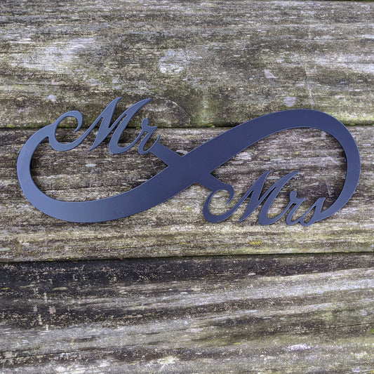 Mr. & Mrs. Infinity Metal Sign Black on weathered wood background