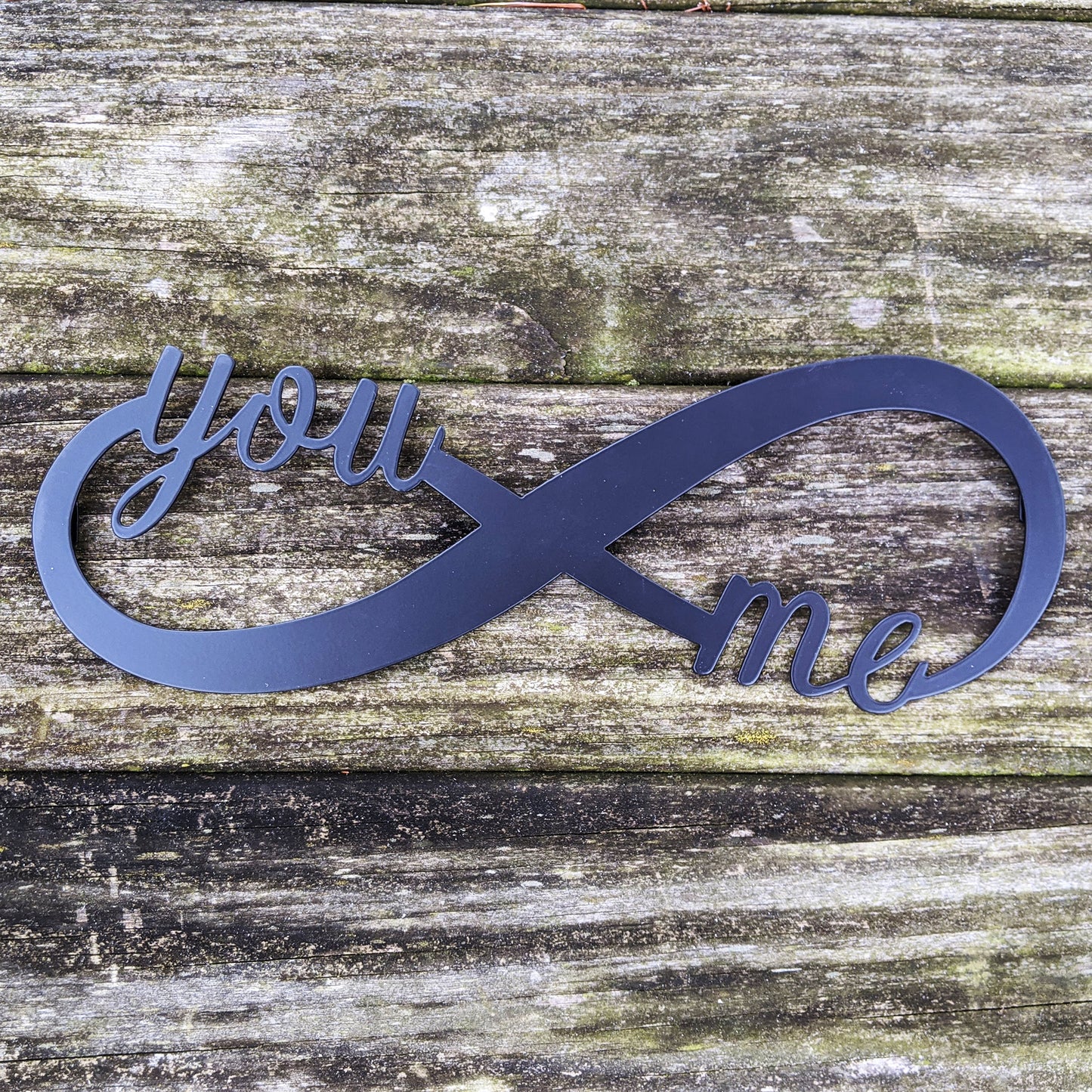 You & Me Infinity Metal Sign in black on aged wood background
