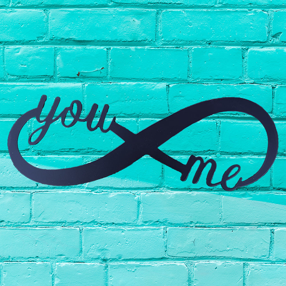 You & Me Infinity Metal Sign in black on teal brick wall