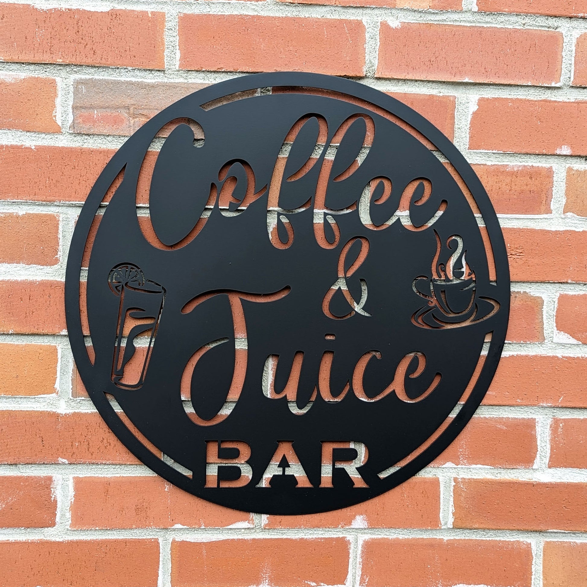 Coffee & Juice Bar Round Metal Sign in black on brick wall background